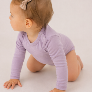 Long-sleeved bodysuit with a buttoned neckline