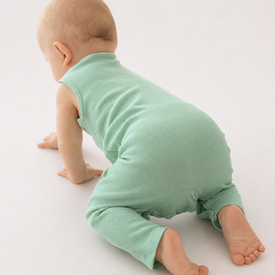 Romper (playsuit) made of 100% organic fine merino with shoulder buttons